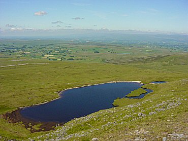 Sand Tarn hides just below the top of Wild Boar Fell