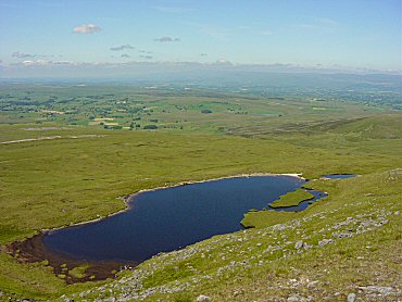 Sand Tarn hides just below the top of Wild Boar Fell