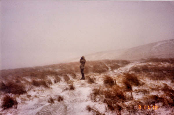 Taking a battering on the climb to Buckden Pike