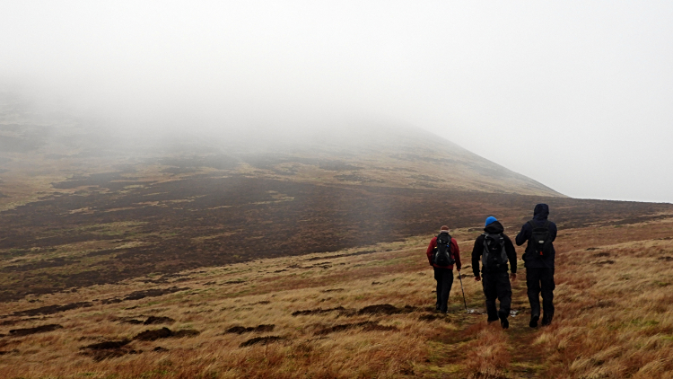 Into the mirk while climbing to Castle Knott