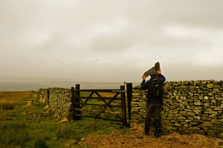 Re-erecting the sign to Beamsley Beacon