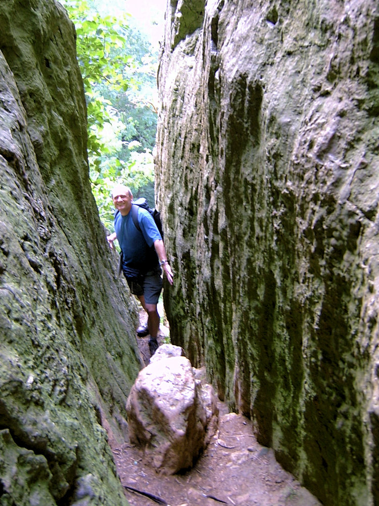 Braving the ledge beside Thor's Cave