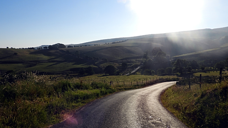 Walking the lonely road at sunrise