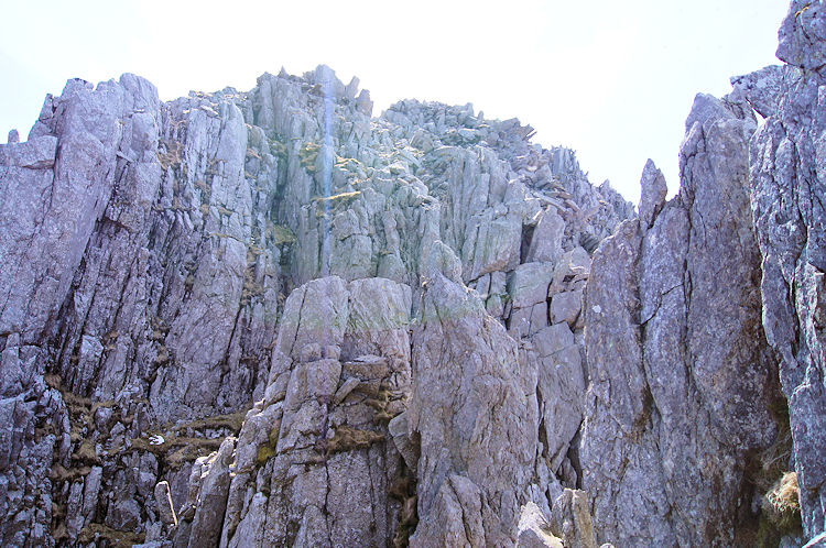 An intimidating rock face poses a logistics problem