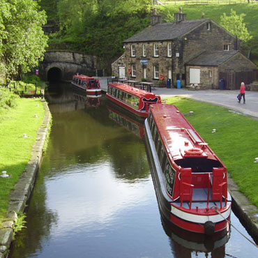 Boats wait in line for a tunnel passage