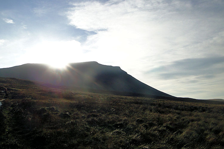 Sun glinting over Ingleborough