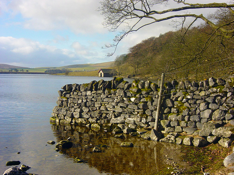 Drystone wall terminating in Malham Tarn