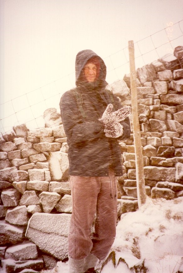 Dave takes shelter by a drystone wall
