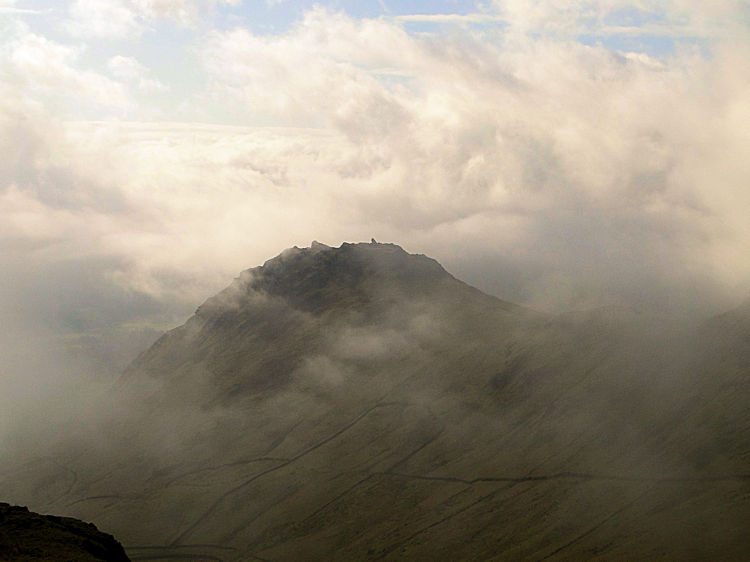 Helm Crag appears out of the mist