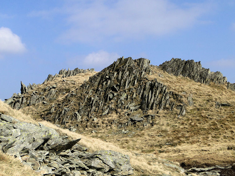 Sharp rock outcrops on Nan Bield Pass