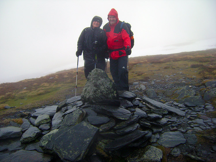 Bedraggled walkers on the summit of Bowscale Fell