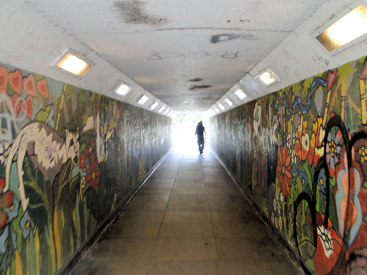 Colourful underpass into town