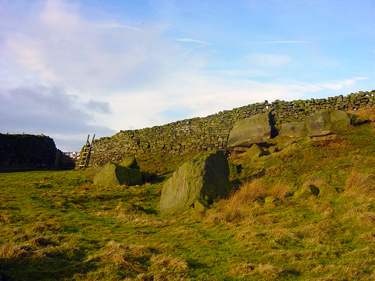 Spittle Ings. Open moor lies over the stile