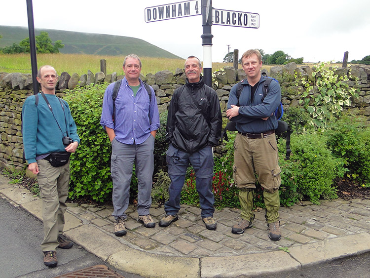 The boys pose at a signpost in Barley