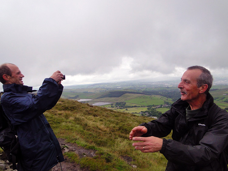 Dave takes a photograph while Steve poses