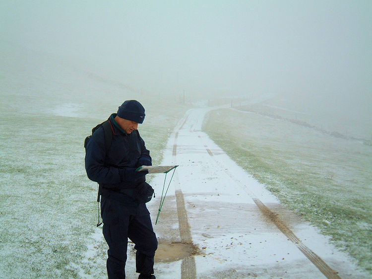 Checking the way with map and compass