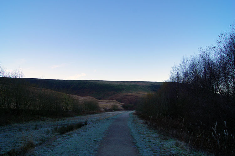 Setting off in winter shade along Longdendale Trail