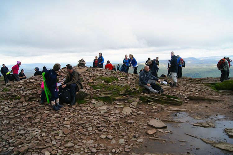 Relaxing after climbing to the summit of Corn Du