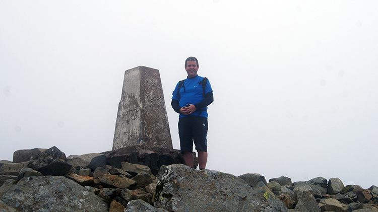 Chris celebrates at the summit